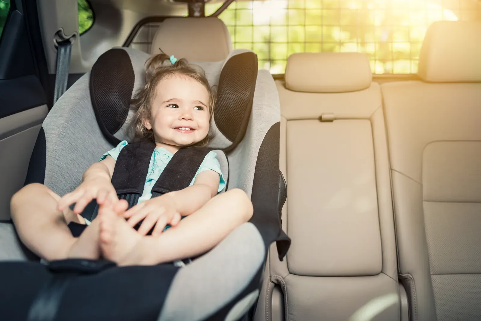 Child car seat installed in the back seat of a car after a collision
