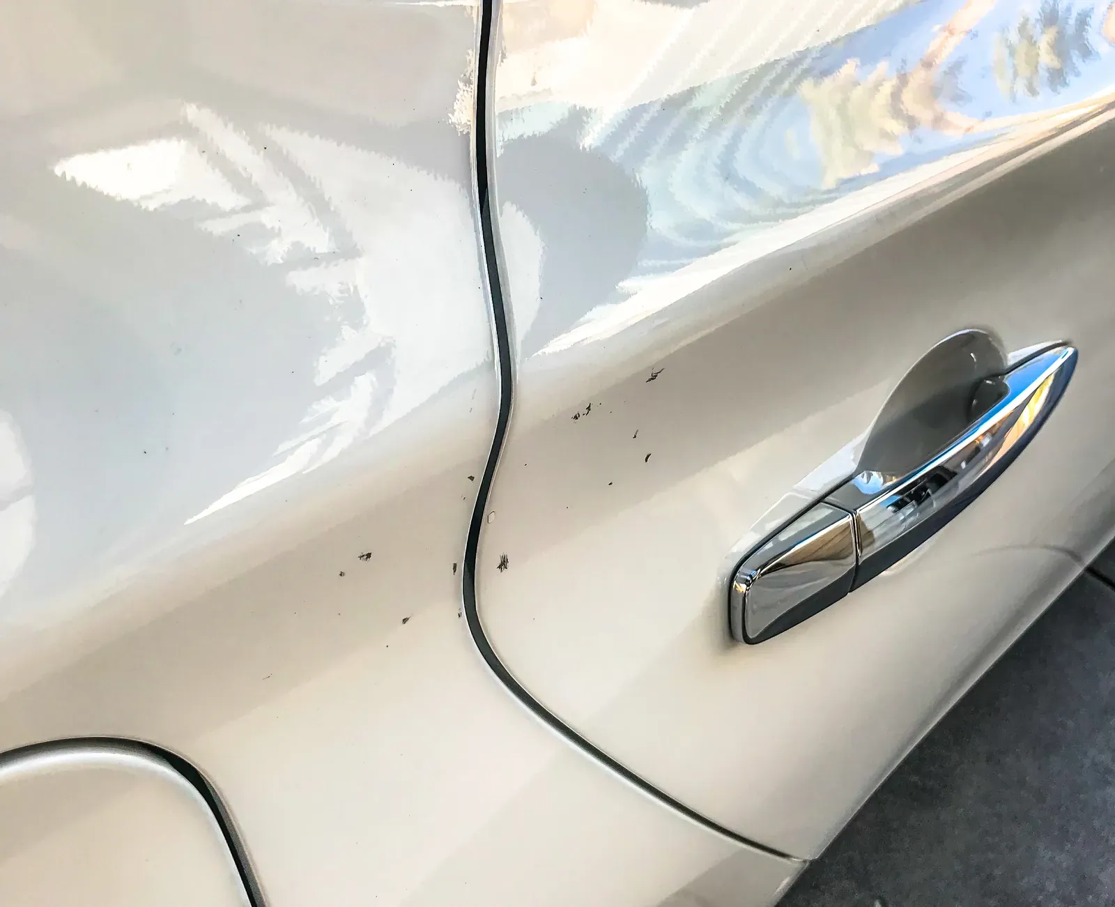 Door ding on a Georgetown vehicle before dent repair at Collision Auto Center