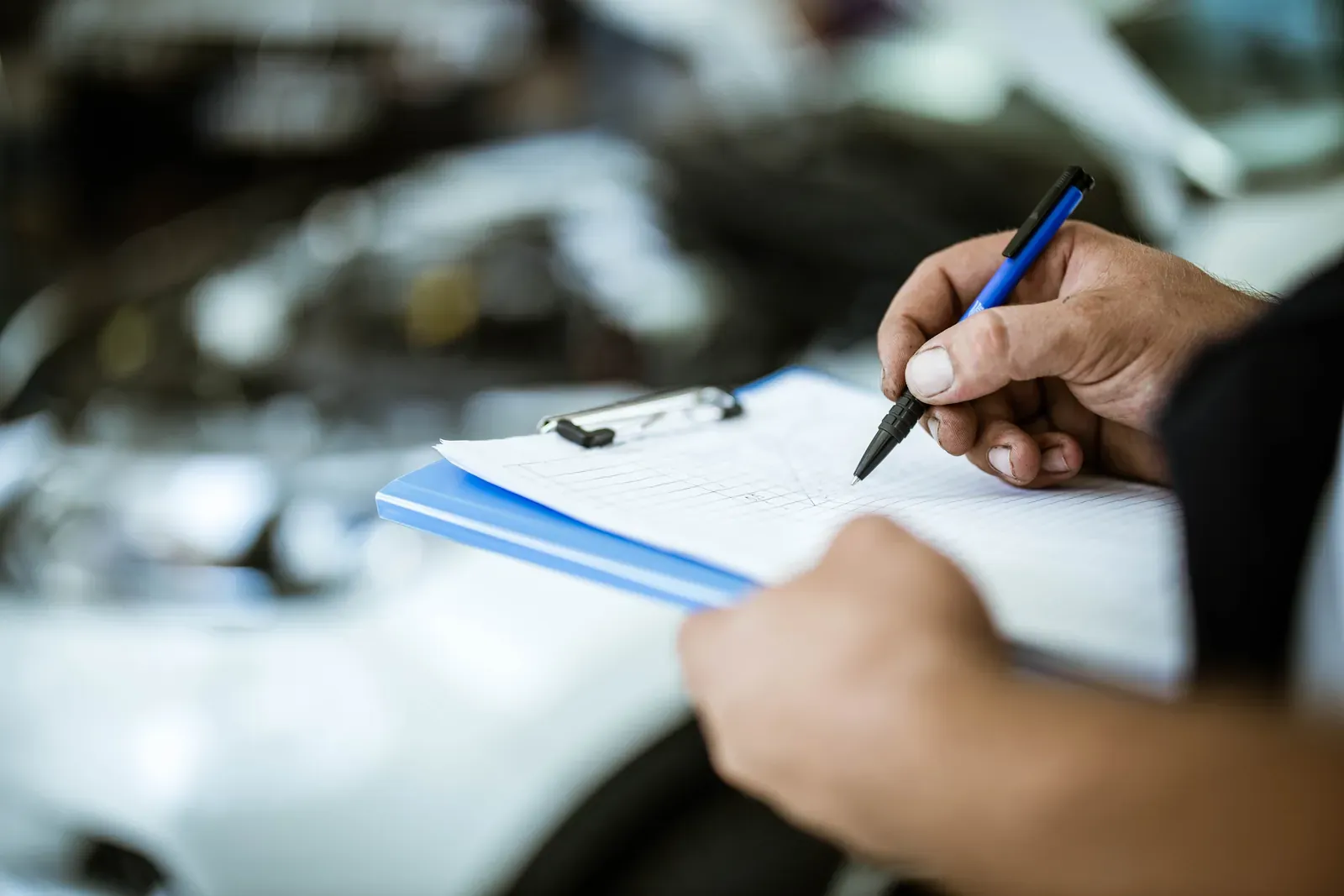 Written repair estimate being prepared for a digital insurance claim at Collision Auto Center