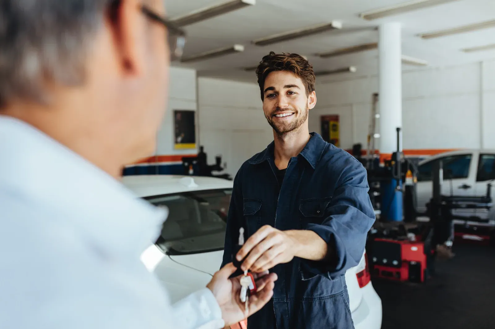 Car keys handed back to a happy customer after the repair