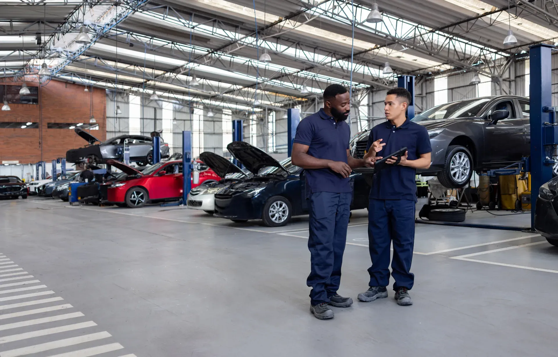 Technicians reviewing a repair plan in the shop
