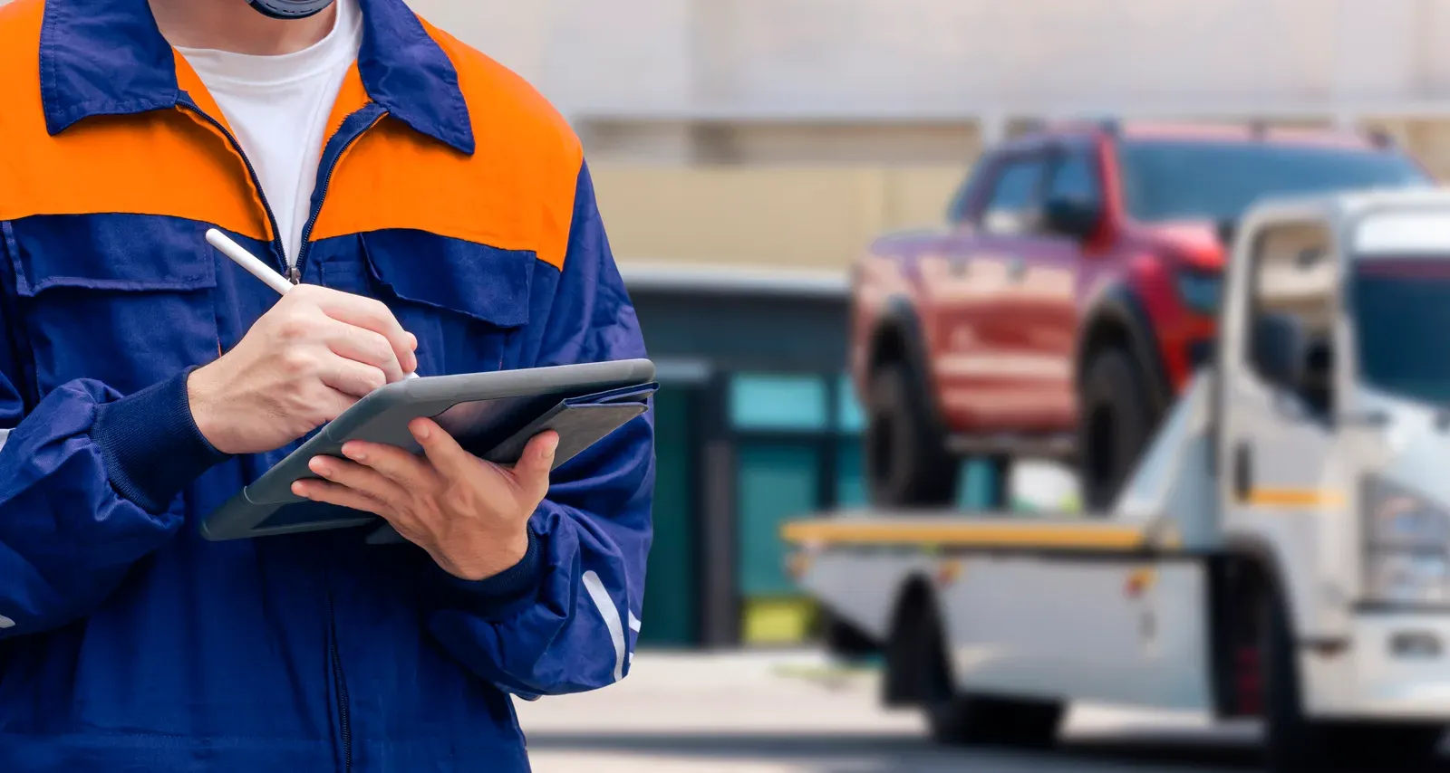 An insurance adjuster documenting vehicle damage
