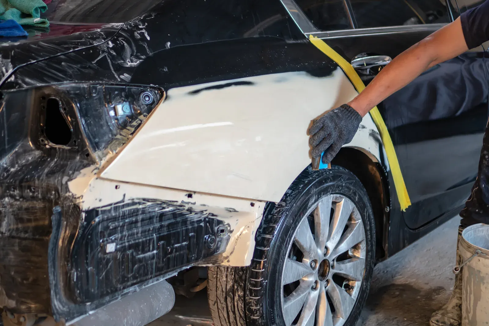 A car fully masked for refinishing