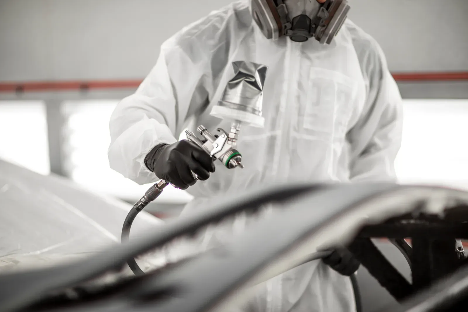 Refinishing work in the spray booth at Collision Auto Center for a vehicle from Caledon
